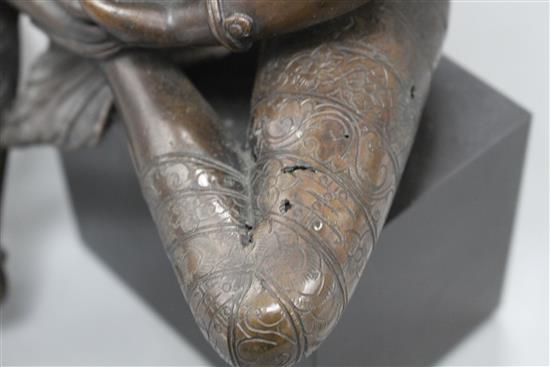 A Sino-Tibetan bronze figure of a seated female deity, on associated marble plinth, height 35cm